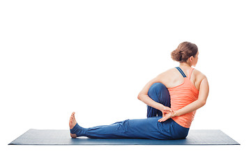 Image showing Woman doing Ashtanga Vinyasa Yoga asana Marichyasana C