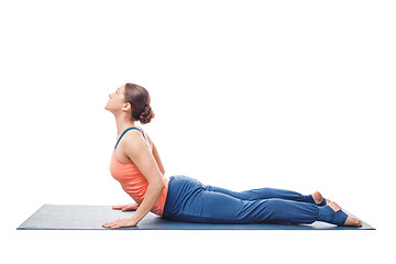 Image showing Sporty fit yogini woman practices yoga asana bhujangasana