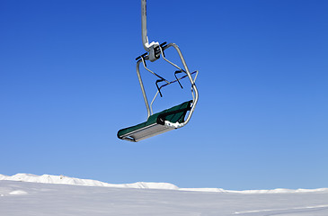 Image showing Chair-lift in ski resort at sun day