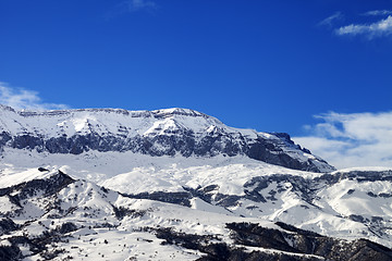 Image showing Snowy mountains and blue sky at nice sun winter day