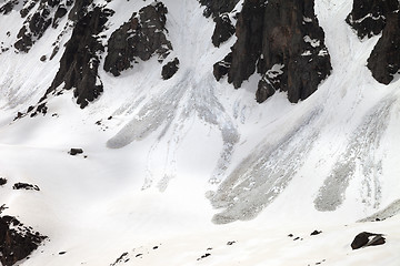 Image showing Snow mountain with traces from avalanche in spring day