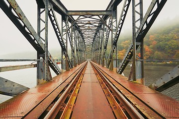 Image showing Old railway bridge in foggy morning