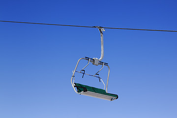 Image showing Chair-lift at ski resort and blue clear sky