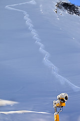 Image showing Off-piste slope with trace from ski and snow gun in sun early mo