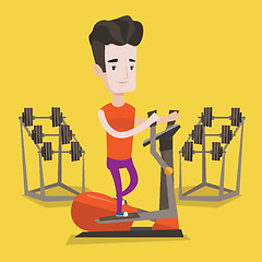 Image showing Man exercising on elliptical trainer.