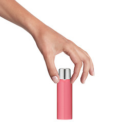 Image showing Female hand with a cosmetics bottle