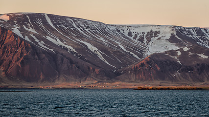 Image showing Small settlement under mountains