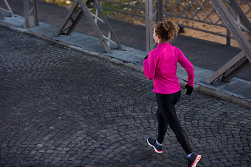 Image showing sporty woman jogging on morning