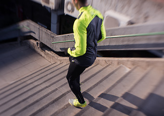 Image showing man jogging on steps