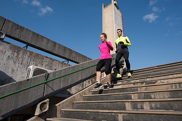 Image showing young  couple jogging on steps