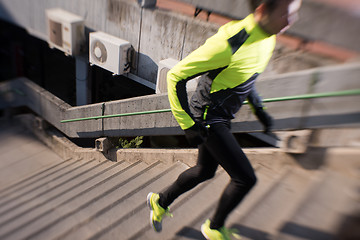 Image showing man jogging on steps
