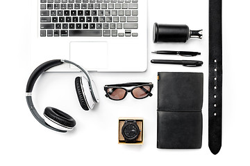 Image showing Still life of casual man. Modern male accessories and laptop on white