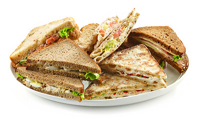 Image showing plate of various triangle sandwiches