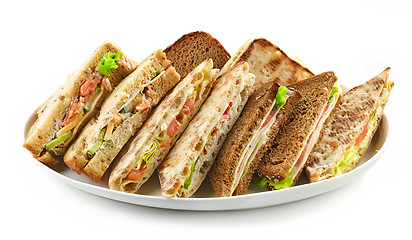 Image showing plate of various triangle sandwiches