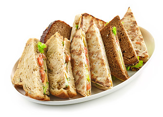 Image showing plate of various triangle sandwiches