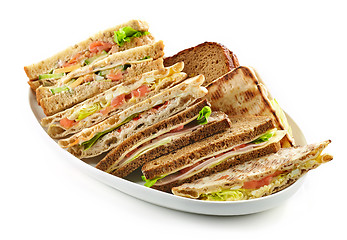 Image showing plate of various triangle sandwiches