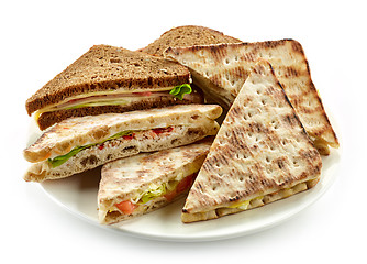 Image showing plate of various triangle sandwiches