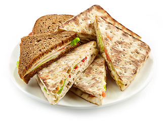 Image showing plate of various triangle sandwiches