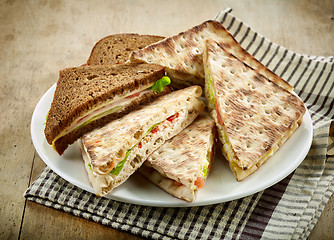 Image showing plate of various triangle sandwiches