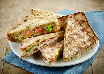 Image showing plate of various triangle sandwiches