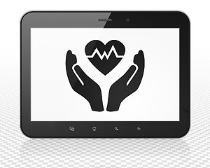 Image showing Insurance concept: Tablet Pc Computer with Heart And Palm on display