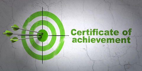 Image showing Studying concept: target and Certificate of Achievement on wall background