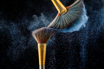 Image showing Combination of powder and fluffy brushes for applying perfect make-up