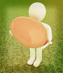 Image showing 3d small person holds the big Easter egg in a hand. 3d image. On