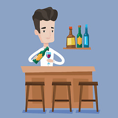 Image showing Bartender standing at the bar counter.