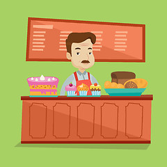 Image showing Worker standing behind the counter at the bakery.