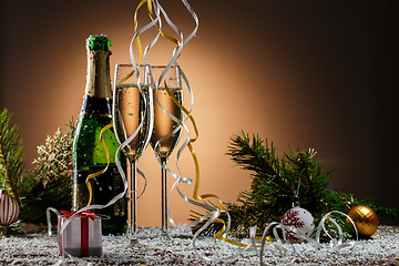 Image showing Champagne glasses, Christmas balls, gift and other symbols of holiday