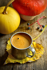 Image showing Cup of coffee and pumpkin on wooden background