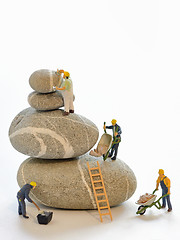 Image showing Pebbles stack and figurines of construction workers