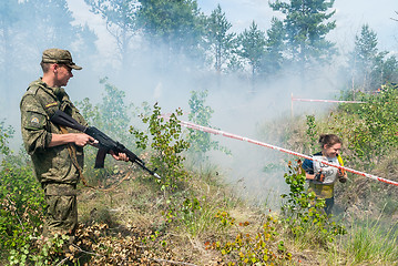 Image showing Athletes run on a ravine in extrim race. Tyumen