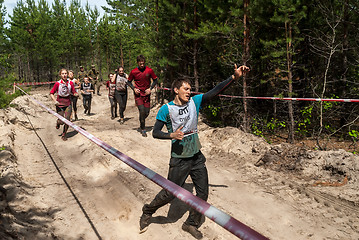 Image showing Sportsmen run between stages in extrim race.Tyumen