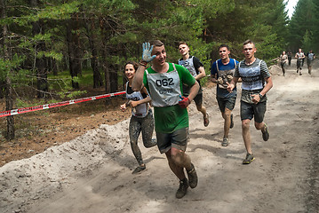 Image showing Sportsmen run between stages in extrim race.Tyumen