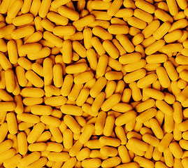 Image showing Macro closeup of orange Tic Tacs scattered