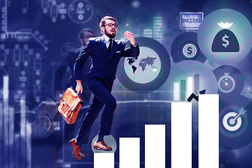 Image showing young businessman jumping over steps of chart or graph