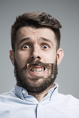 Image showing Portrait of young man with shocked facial expression