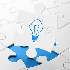 Image showing Business concept: Light Bulb on puzzle background