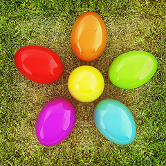 Image showing Colored Easter eggs as a flower on a green grass. 3D illustratio