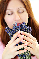 Image showing Woman smelling lavender