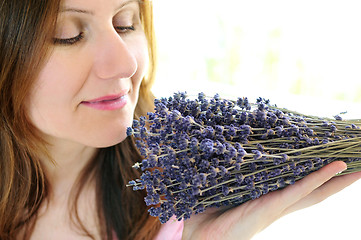 Image showing Woman smelling lavender