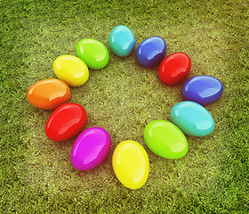 Image showing Colored Easter eggs on a green grass. 3D illustration. Vintage s