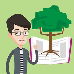 Image showing Student pointing at tree of knowledge.