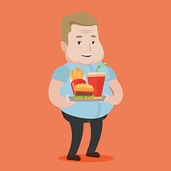 Image showing Man holding tray full of fast food.