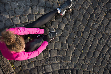 Image showing woman  stretching before morning jogging