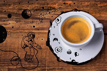 Image showing Coffee cup on a wooden table.