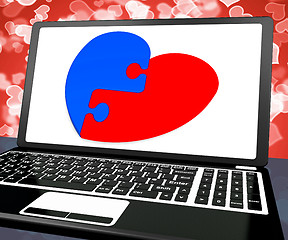 Image showing Puzzle Heart On Laptop Shows Engagement