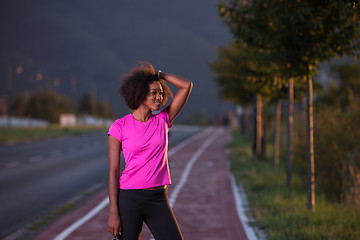 Image showing Portrait of a young african american woman running outdoors